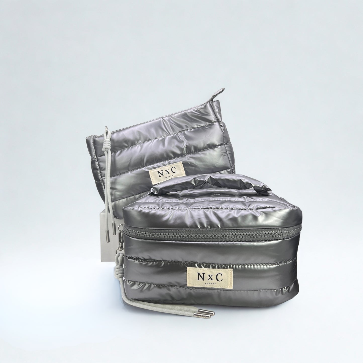 The NxC Puffer Travel Set in Graphite